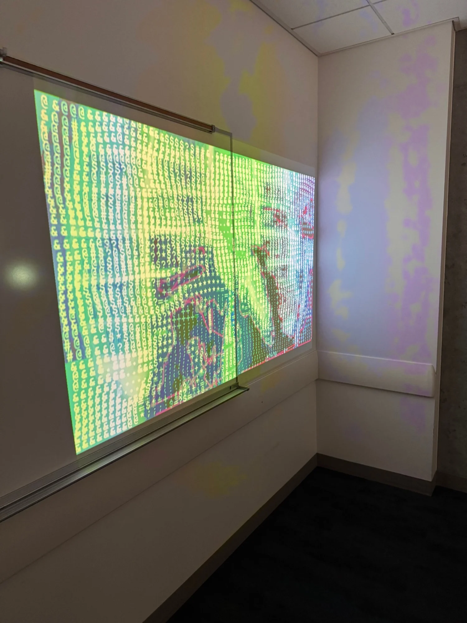 A projection close up, the frame redrawn in ASCII characters by the cancel culture strip